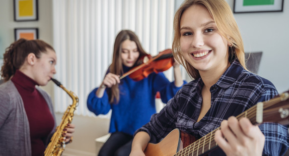Young women playing music